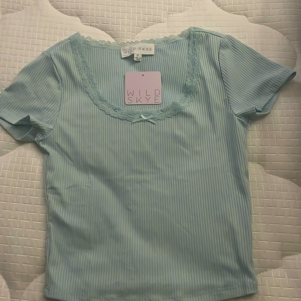 The brand is wild sky, and it is in size small the perfect blue color
